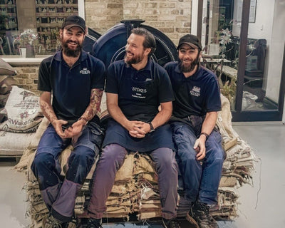 The Master Roasters sat on the coffee sacks in the roastery