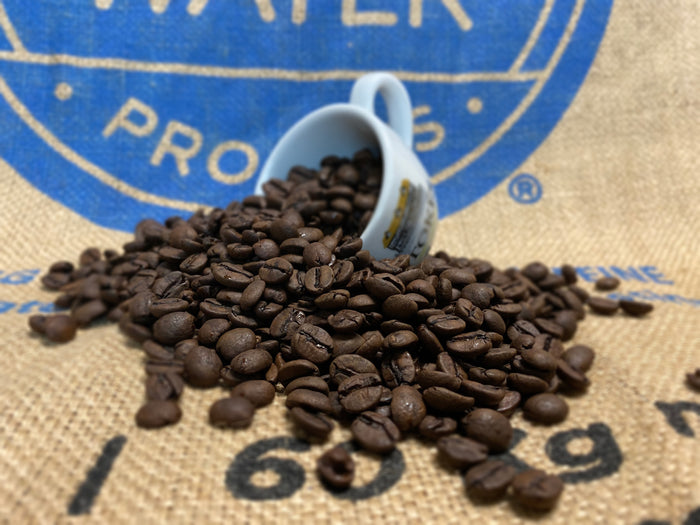 Decaf Coffee Beans Spilling out of stokes espresso cup