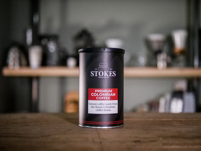 Small instant coffee tin, on top of a shelf