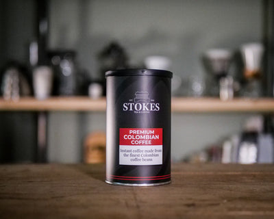 Small instant coffee tin, on top of a shelf