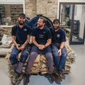 The Master Roasters sat on the coffee sacks in the roastery