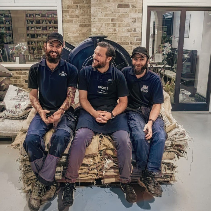 The Master Roasters sat on the coffee sacks in the roastery