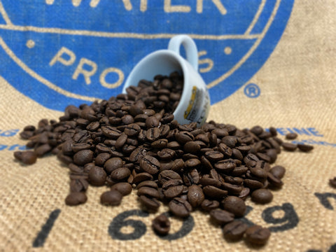 Decaf Coffee Beans Spilling out of stokes espresso cup