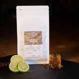 Sidamo Coffee Beans Bag with Lime & pot of honey to show tasting notes.