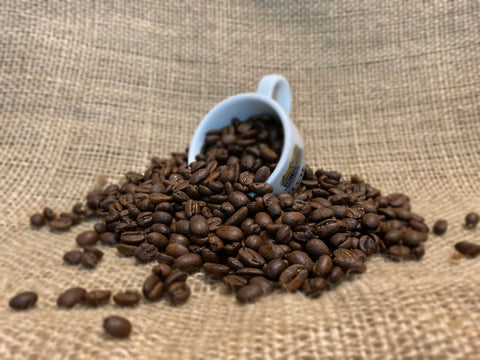 Flirt Coffee Beans spilling out of Stokes Espresso Cup